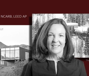 Picture of Anne Mooney in black and white in front of architecture scenery.